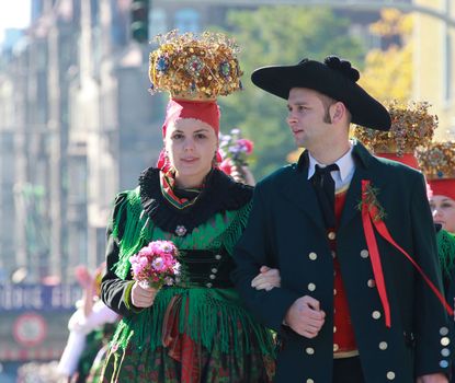 Franconian harvest festival parade A couple wearing traditional costumes at the harvest festival parade on the occasion of the Michaelis Kirchweih Fair