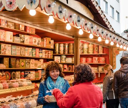 Michaelis-Kirchweih Fair Booth at the Michaelis-Kirchweih Fair with two customers in the fore